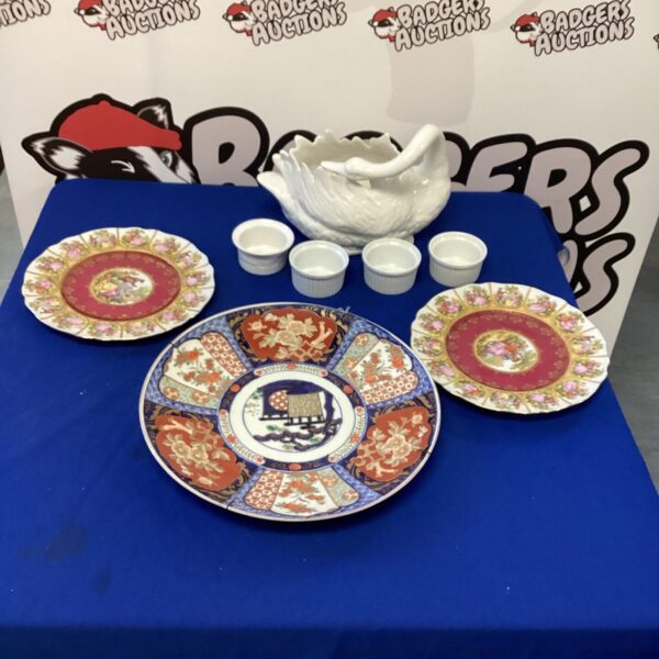 Vintage porcelain swan plant pot holder with decorative plates.