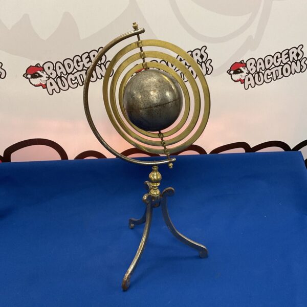 Vintage brass and steel armillary sphere globe for display.