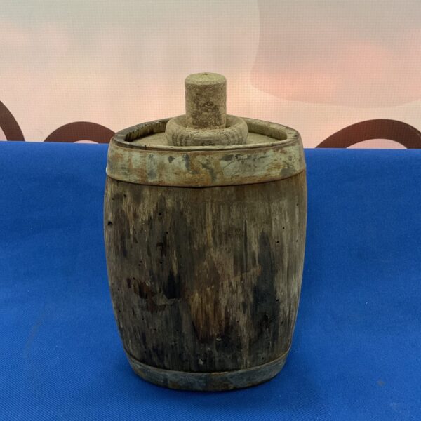 Small vintage Italian wine barrel with metal bands.