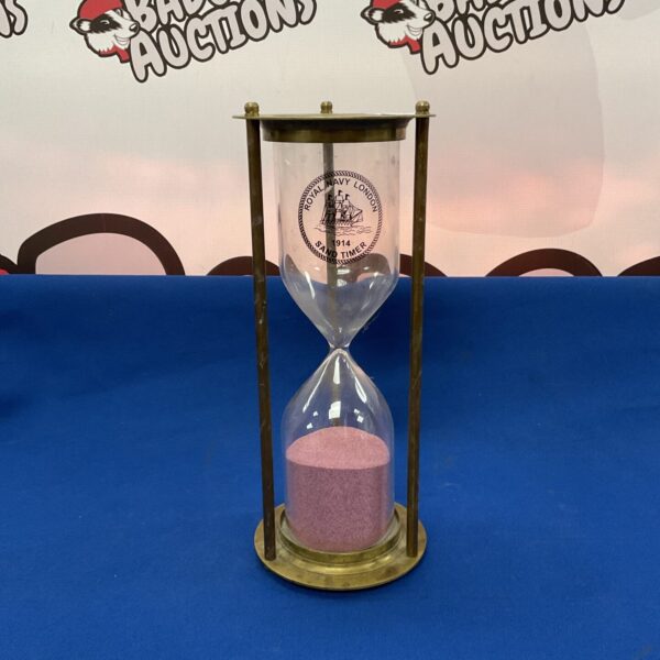 Antique brass Royal Navy London hourglass for timekeeping.