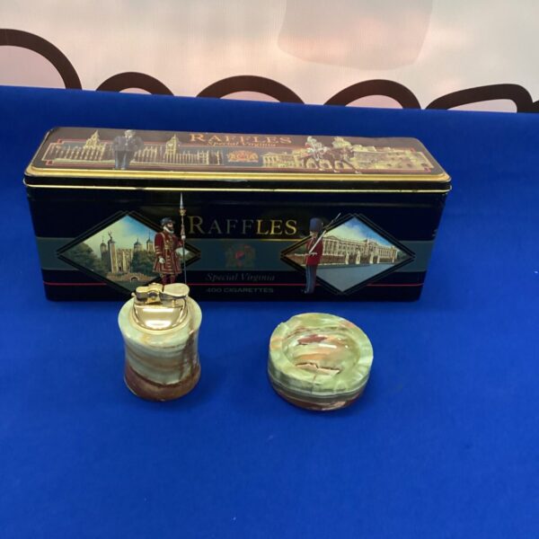 Vintage Raffles cigarette set with lighter, ashtray, and tin.