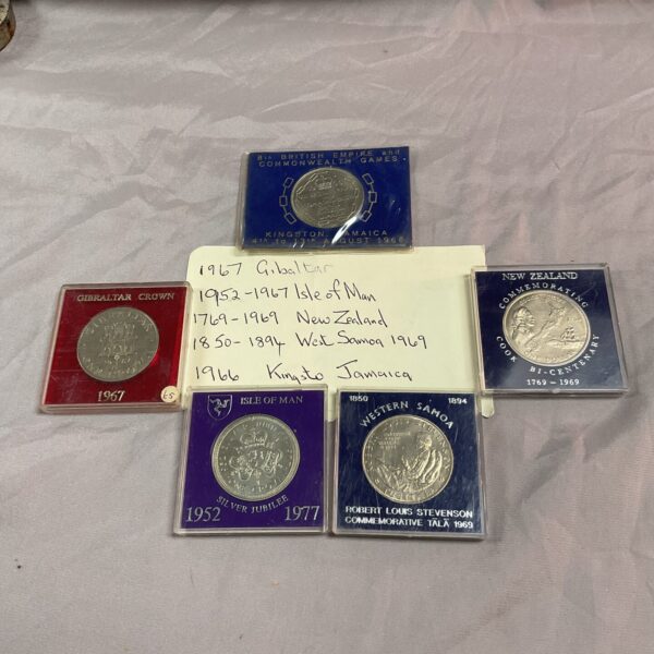 Commemorative crowns and dollars from Jamaica and Gibraltar coin collection.