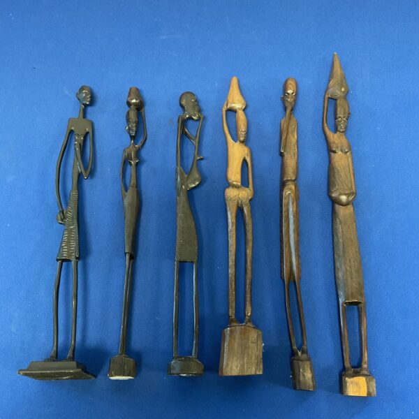 Lot of six African tribal figures carved from wood and metal.