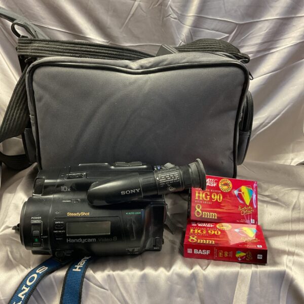 Vintage Sony CCD-TR606E 8mm camcorder with strap and tape.