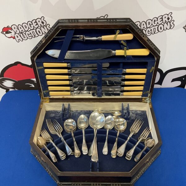 Vintage Sheffield plate cutlery set with bone handles in a case.