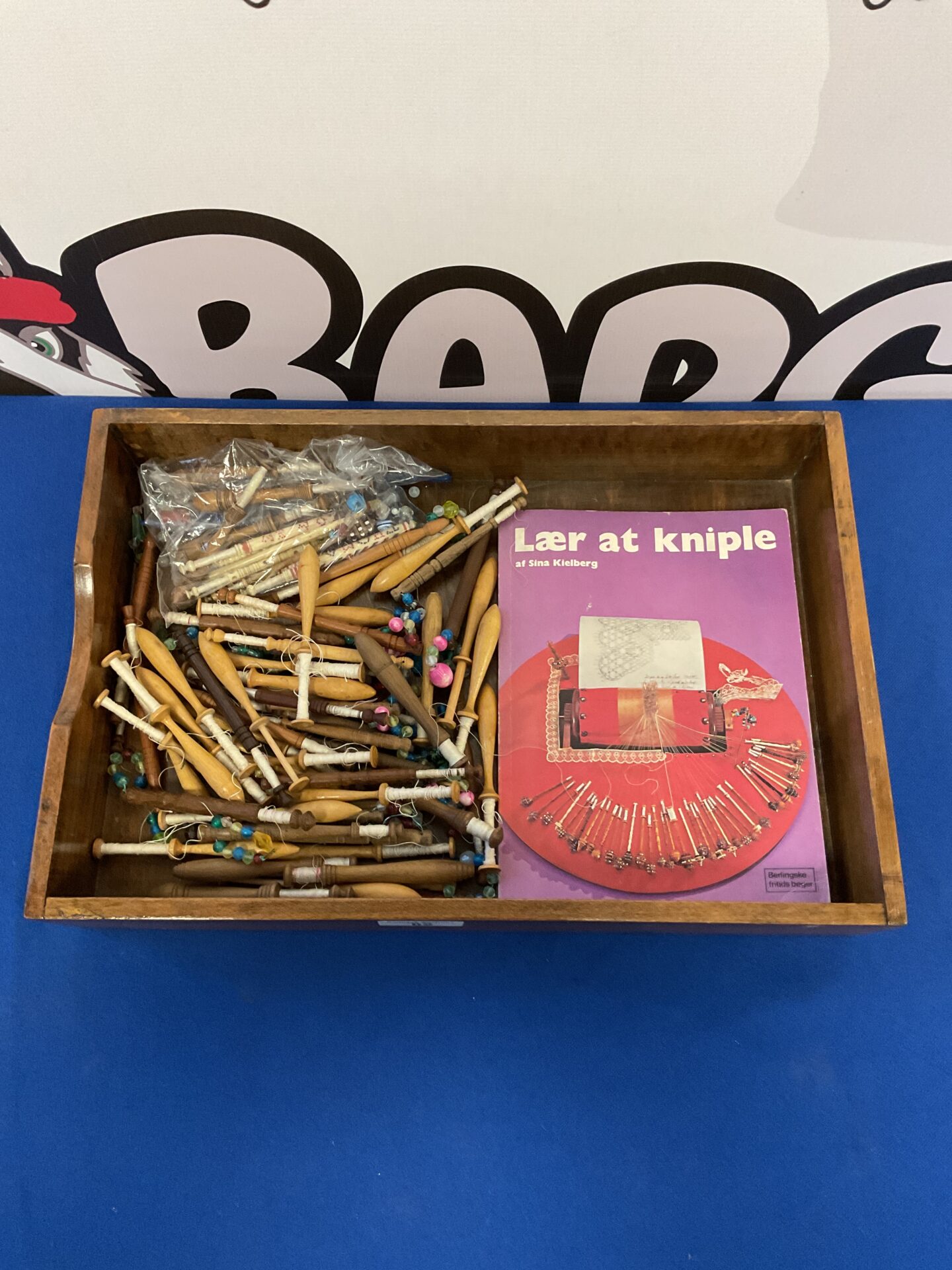 062 Collection of lace bobbins with book