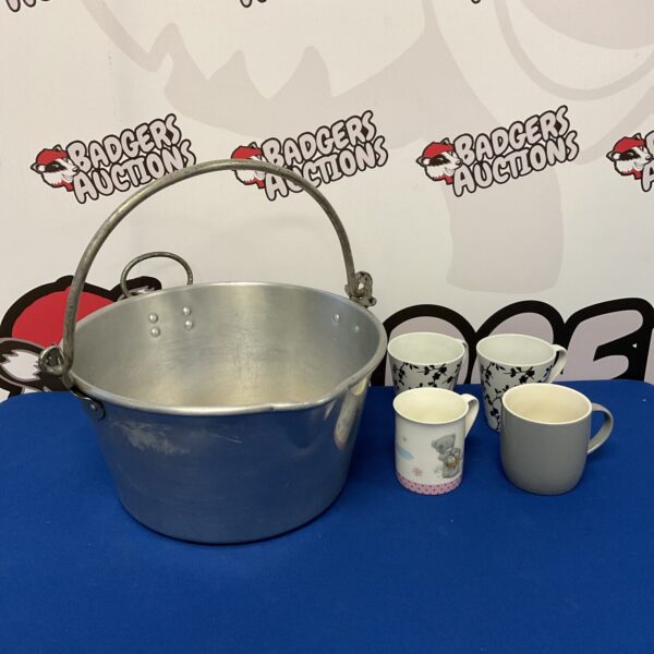 Large stainless steel jam pan with handles, ideal for cooking.