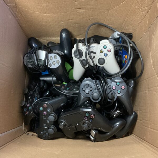 Large lot of pre-owned PlayStation 3 and Xbox gaming controllers.
