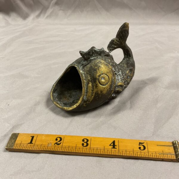 Vintage brass fish ashtray, mid-century modern collectible.