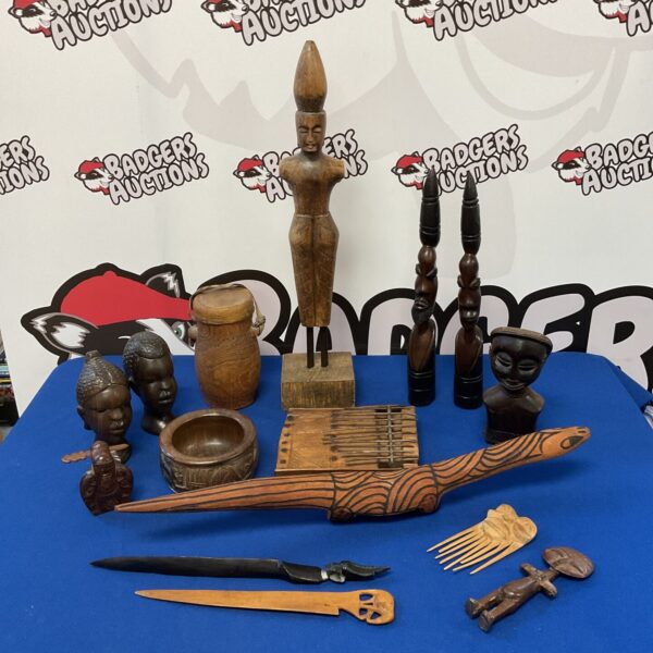 Collection of carved African hardwood figures and comb.