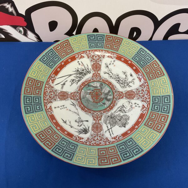 Antique Chinese Famile Rose charger with floral and bird designs.