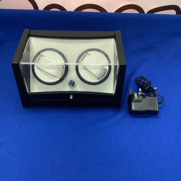 Clear acrylic display case watch winder with power adapter.