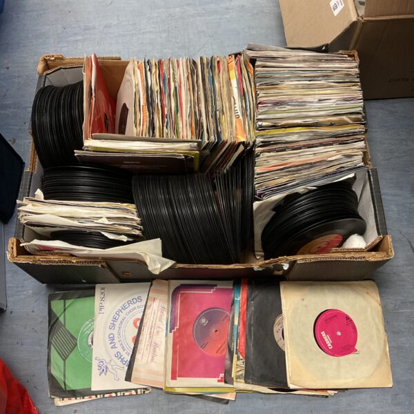 Large lot of vintage 7 inch vinyl records for collectors.