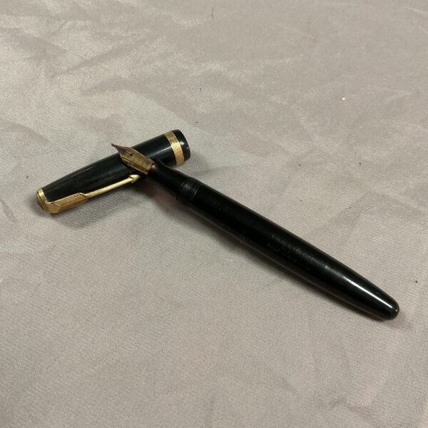 Vintage black and gold Parker Duofold fountain pen, classic writing instrument.