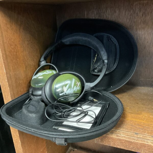 Vintage Bose QC2 headphones in a carrying case.