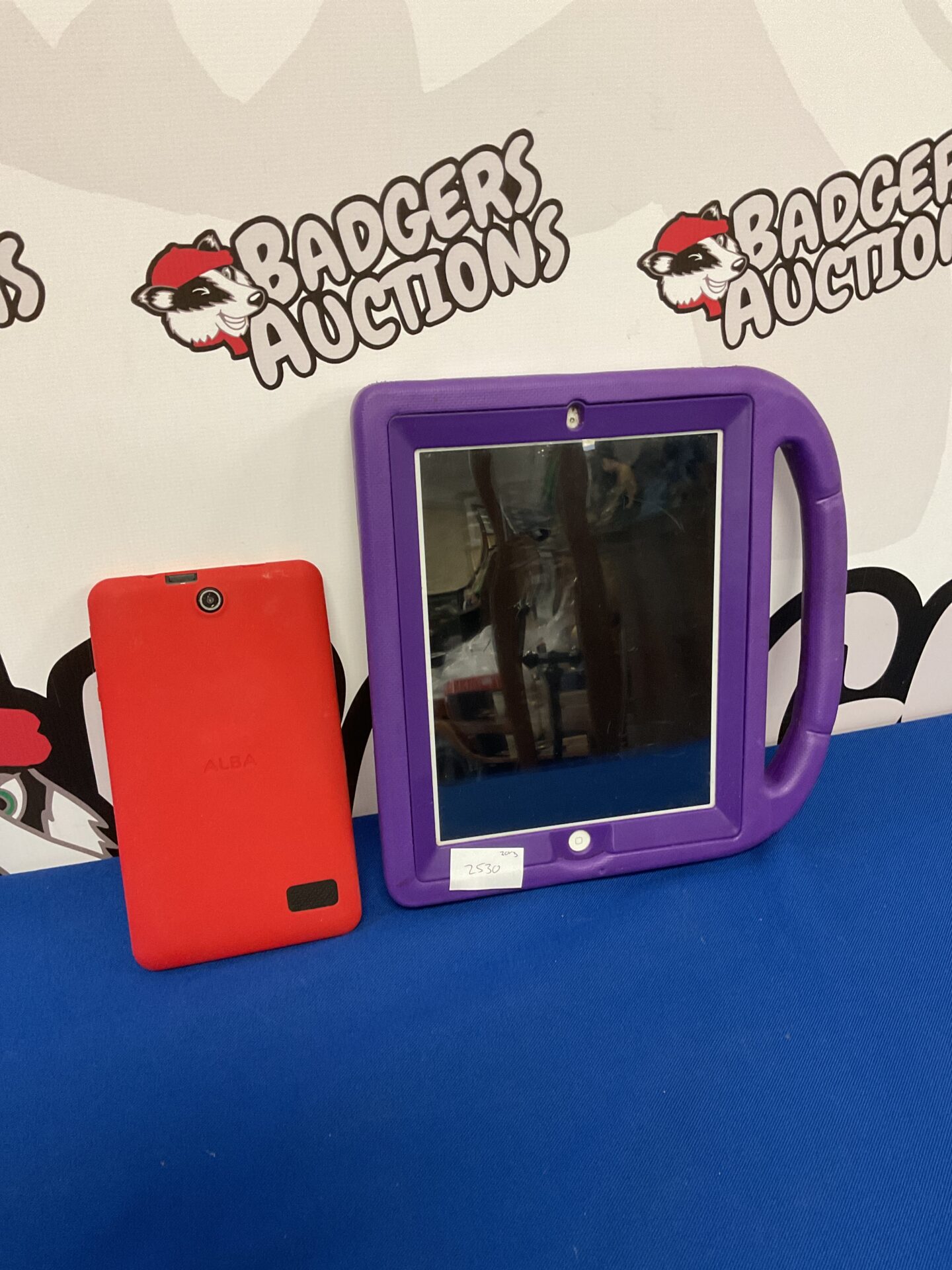 085 Apple ipad, powers on but locked & alba tablet