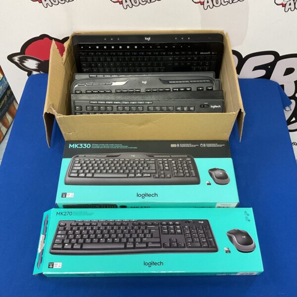 Boxed computer keyboards including Logitech models for PC gaming.