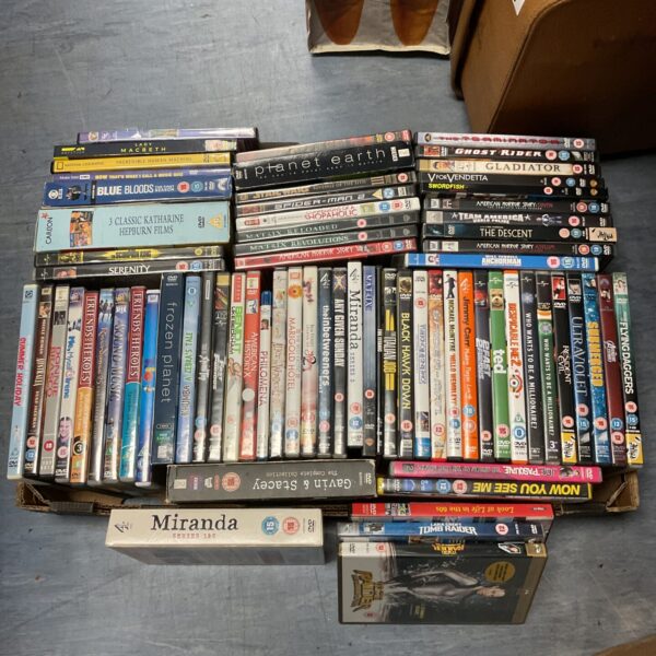 Assorted DVD tray lot with boxsets and various films.