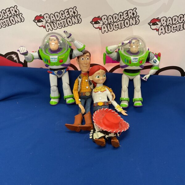 Group of Disney Pixar Toy Story figures including Buzz Lightyear and Woody.