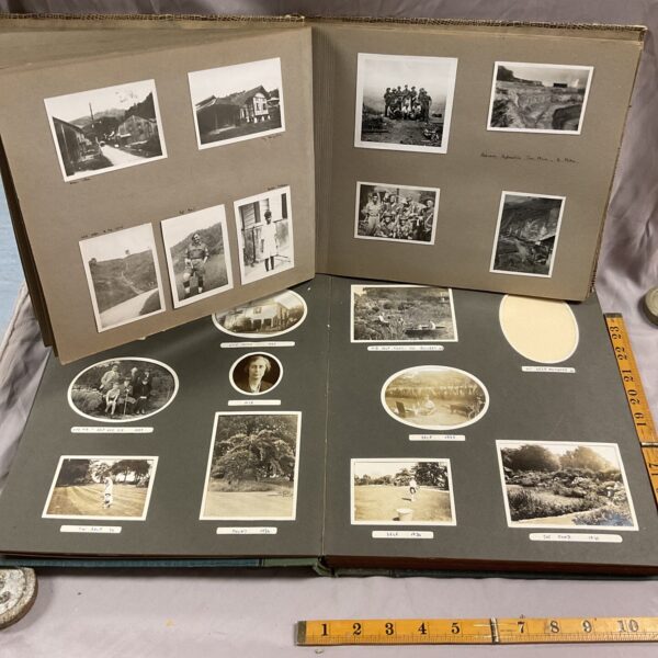 Spread from a vintage photo album showing black and white photographs of Malaysia.