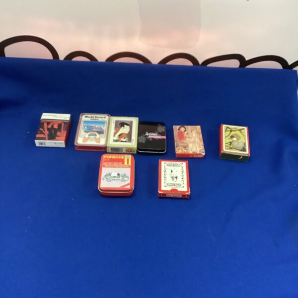 Vintage playing cards collection featuring Porsche Owners Club deck.