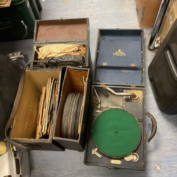 Vintage Salon Decca gramophone with boxes of records for collectors.