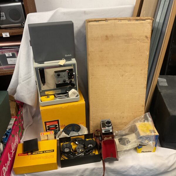 Vintage Kodak Brownie 8 movie camera and projector set with screen.