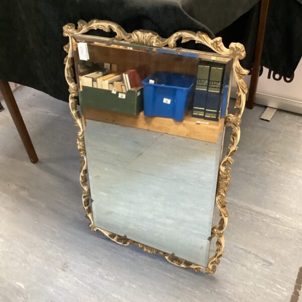Ornate antique Astonia gilt framed mirror for wall decoration.