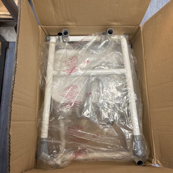 New shower seat still sealed in its original cardboard box.