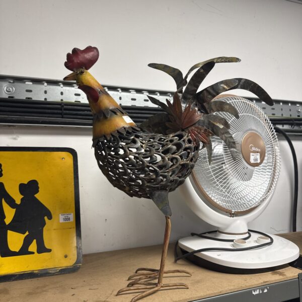 Vintage metal garden cock ornament, rustic rooster sculpture.