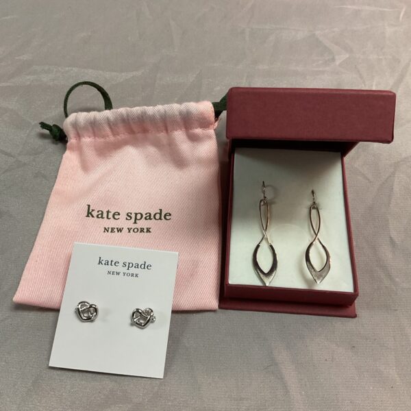 Kate Spade silver earrings displayed in a box.
