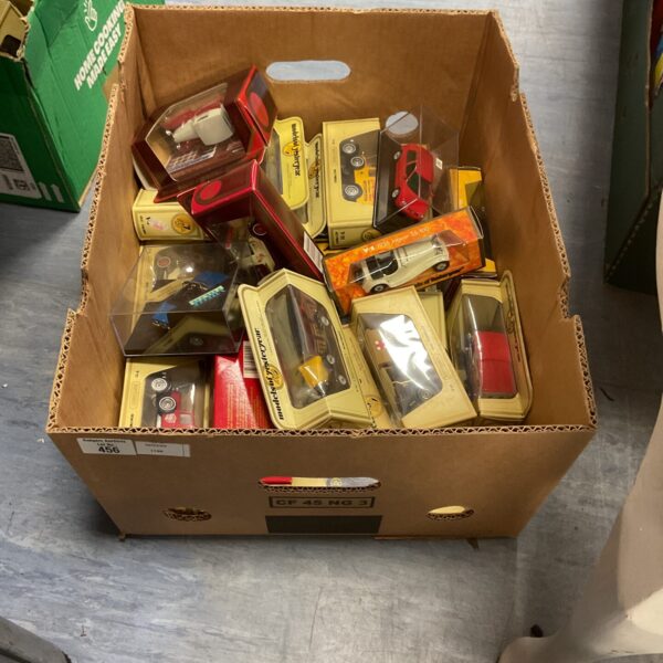 Boxed diecast model cars, including Matchbox, in a mixed lot.