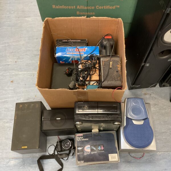 Sonos speaker bundle with mixed electrical items in a cardboard box.