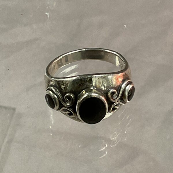 Silver Art Nouveau ring with black onyx stones.