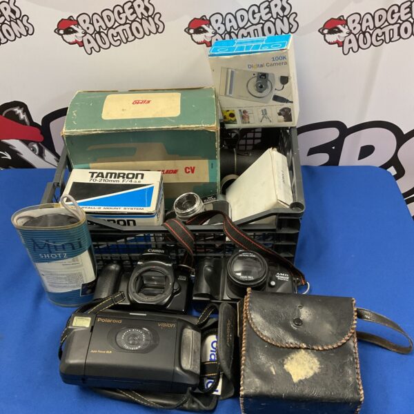 Vintage camera lot including Polaroid Vision and Canon EOS 1000F.