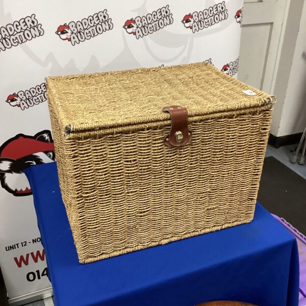 Vintage folding wicker basket with a classic design.