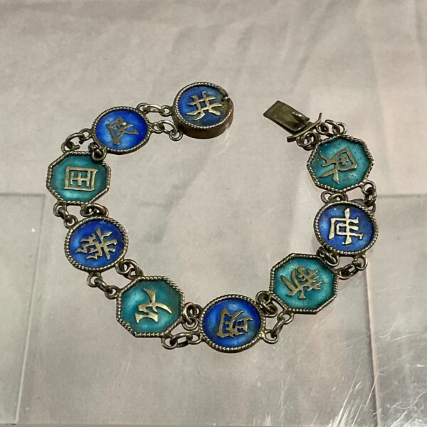 Antique Chinese silver enamel bracelet with floral designs.