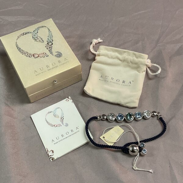 Silver tone and crystal Aurora Swarovski bracelet, close-up view.