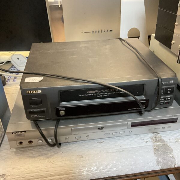 Vintage Aiwa VHS and Vision DVD player combo unit.