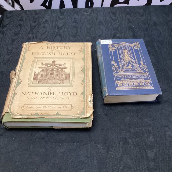 Vintage architecture books with worn covers, history of English house.