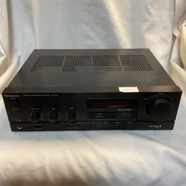 Front view of a vintage Technics SU-X301 stereo amplifier.