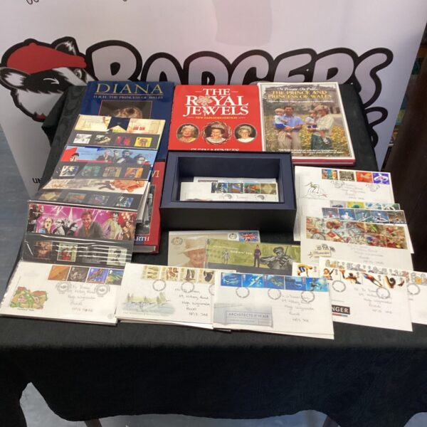 Royal Family book collection with Royal Jewels and First Day Covers.
