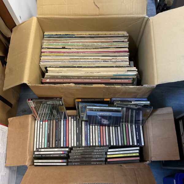 Mixed lot of vinyl records and CDs for music collectors.