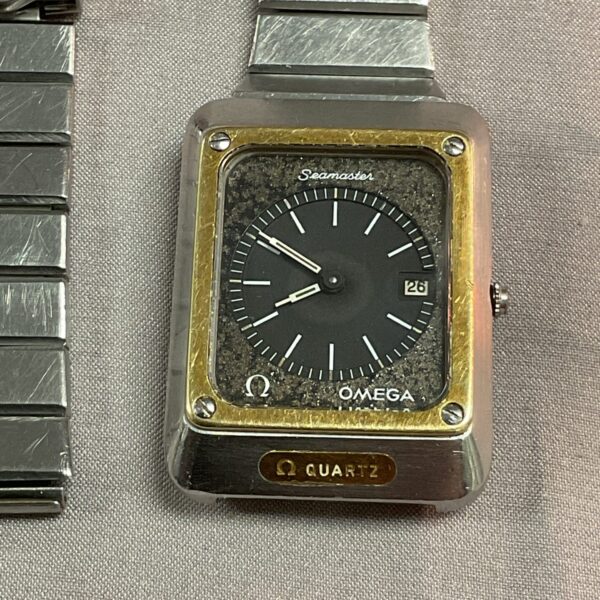 Close-up of vintage Omega Seamaster stainless steel watch strap.