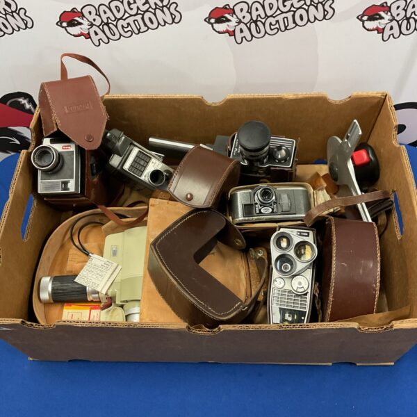 Lot of vintage 8mm cine cameras including Bell & Howell and Kodak models.