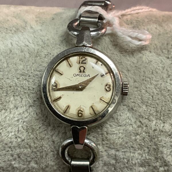 Vintage Omega ladies watch with expanding strap, silver tone.