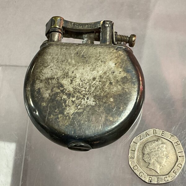 Vintage Dunhill silver plate pocket lighter with coin for scale.
