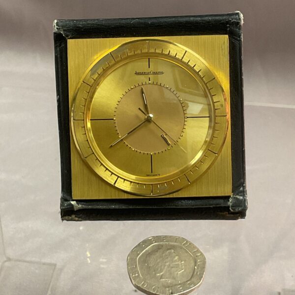 Vintage Jaeger LeCoultre travel alarm clock with classic dial.