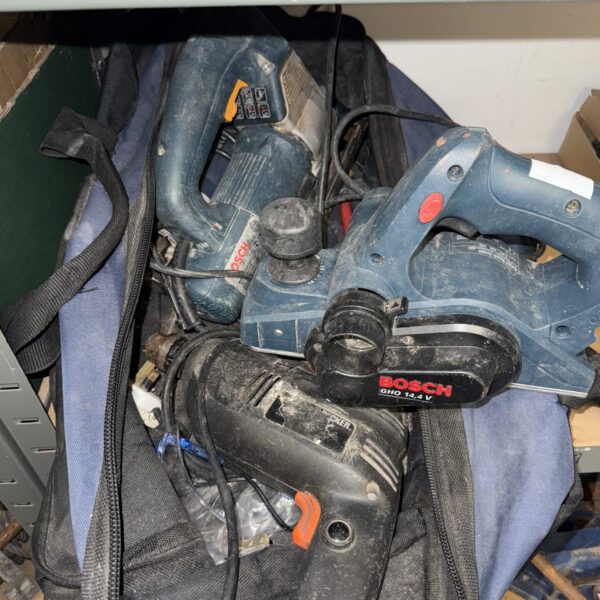 Bosch power tool lot in a black carry bag, including a drill.