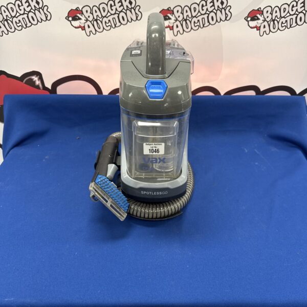 Vax Spotless Go cordless carpet cleaner, handheld spot cleaning appliance.